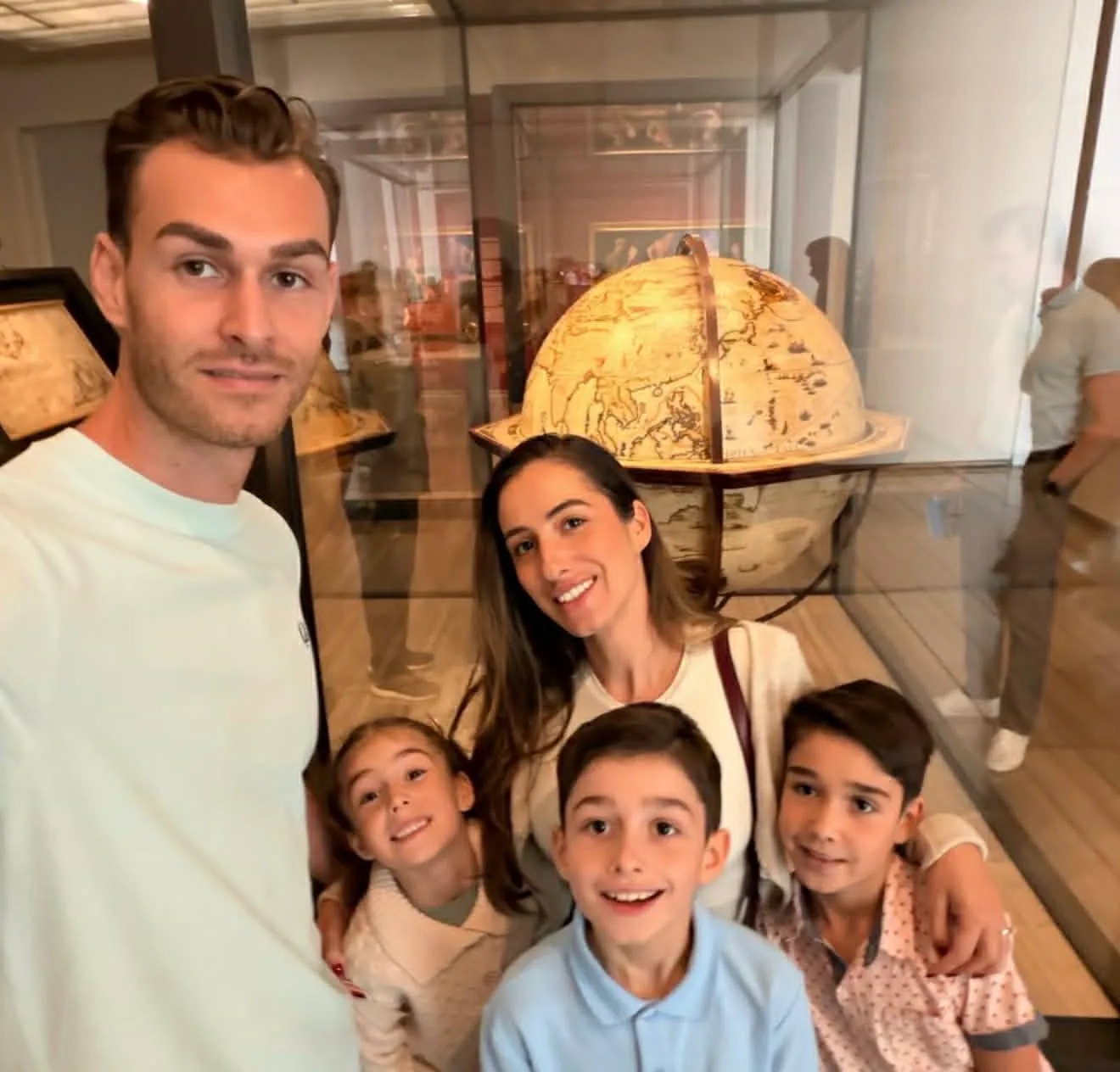 Nico, Cass and their three kids visiting a museum together